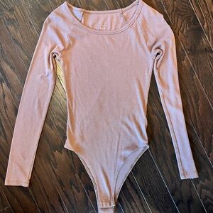 A New Day light brown, long sleeve bodysuit. Never worn. Size XS